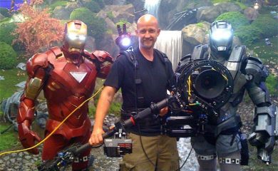 Man with camera stabilisation equipment with film superheroes