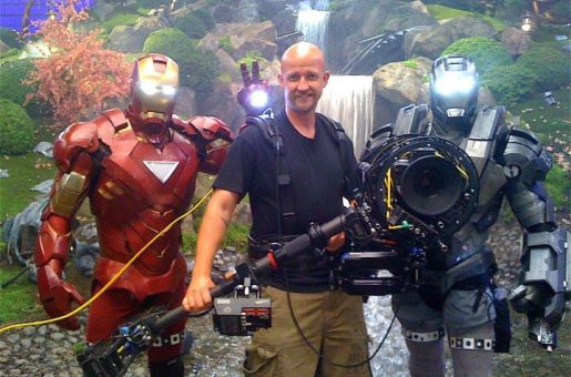 Man with camera stabilisation equipment with film superheroes